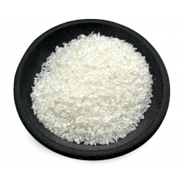 Coconut flakes in a dark bowl