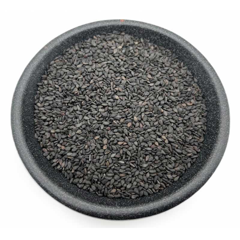 Black sesame seeds in a dark bowl