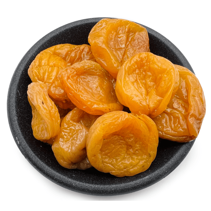 Dried apricots in a dark bowl
