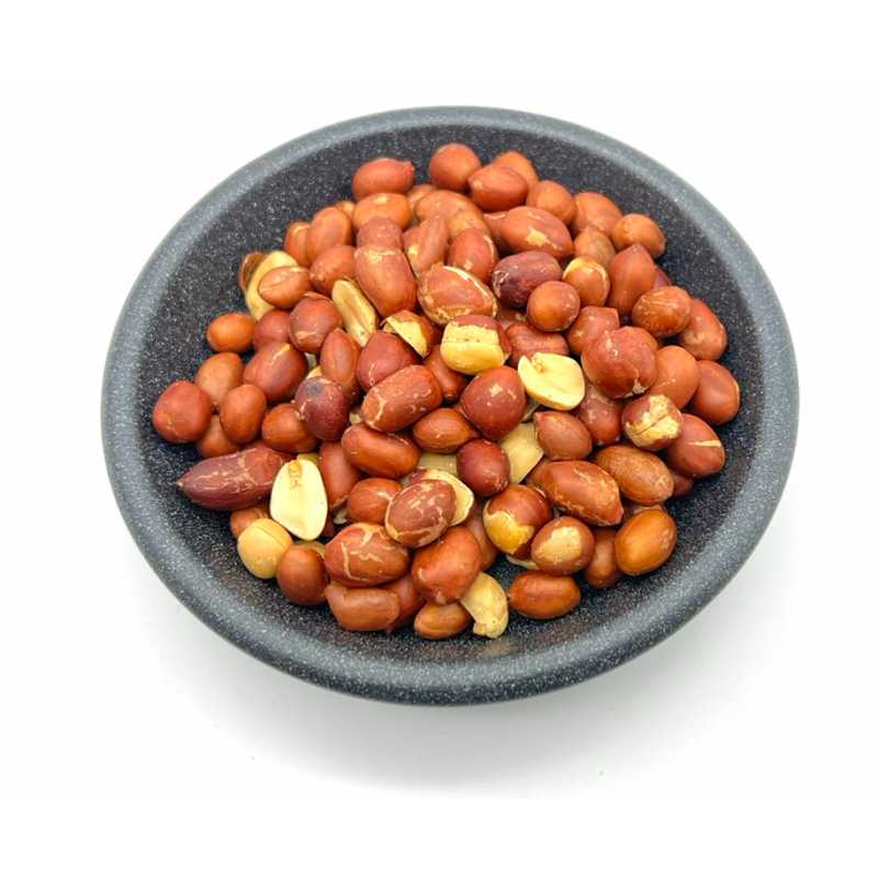 Roasted red-skin peanuts in a dark bowl